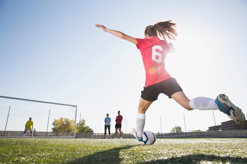 girl playing soccer girl playing soccer