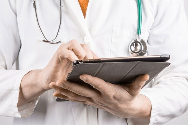 doctor-with-tablet Diagnostic Imaging Services