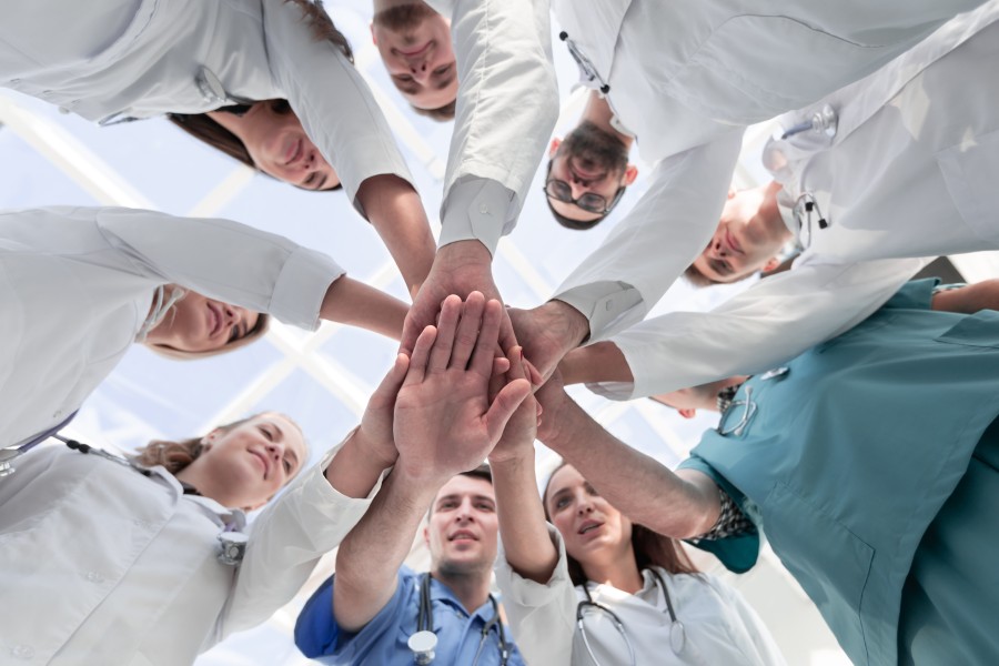 Medical Professionals Touching Hands